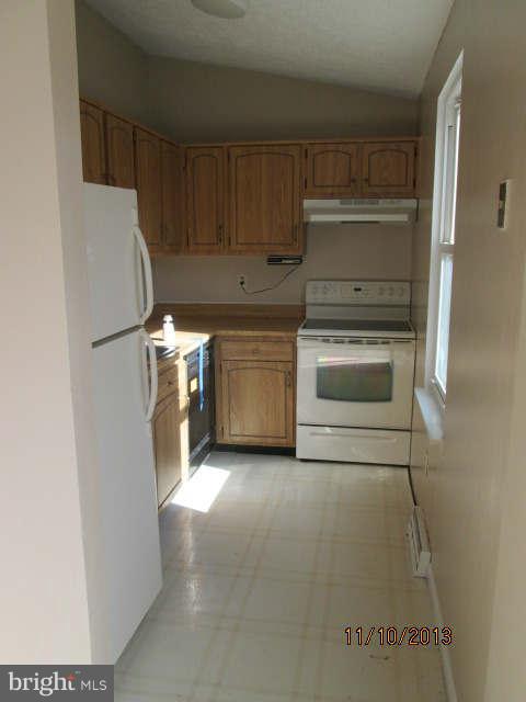 81 Haverhill Road Joppa, MD 21085 - Photo 8 of 18 a kitchen with a refrigerator and a stove
