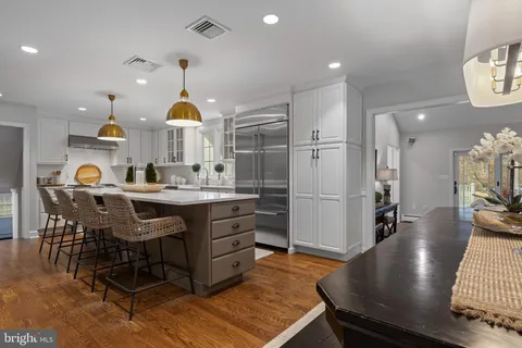 a storage room with washer and a painting on the wall