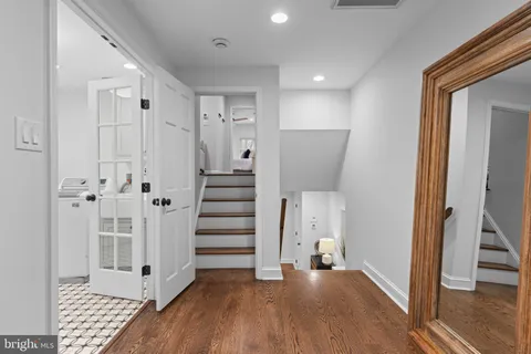 a view of a bathroom with a sink and mirror
