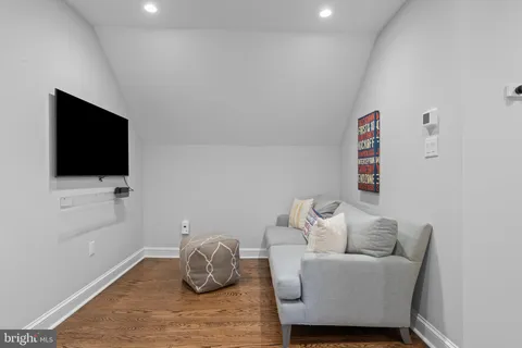 a view of a patio with table and chairs potted plants with wooden floor