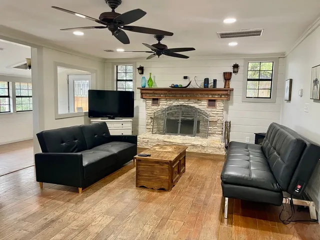 a living room with furniture and a fireplace