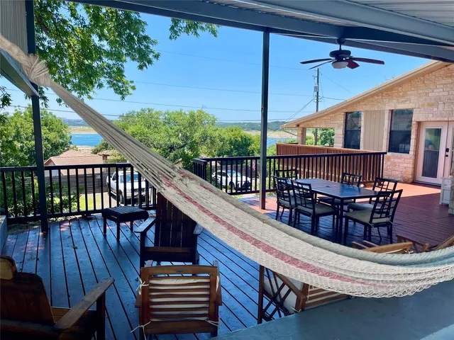 a view of a balcony with chairs