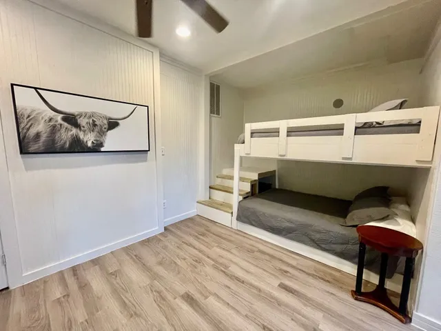 a bedroom with a bed and a chair