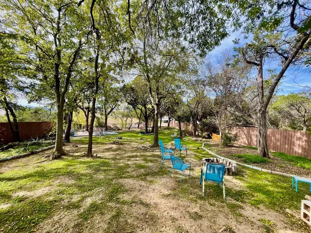 a view of a balcony with chair and table