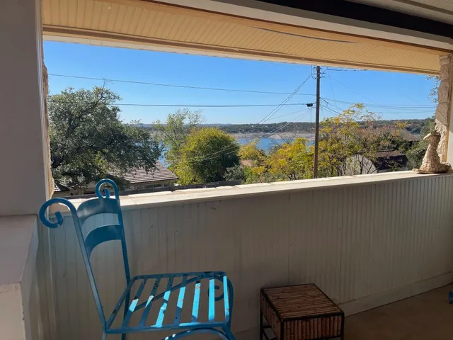 a view of balcony with furniture
