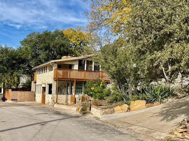 a view of a house with a tree park