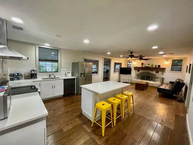 a kitchen with a table and chairs in it