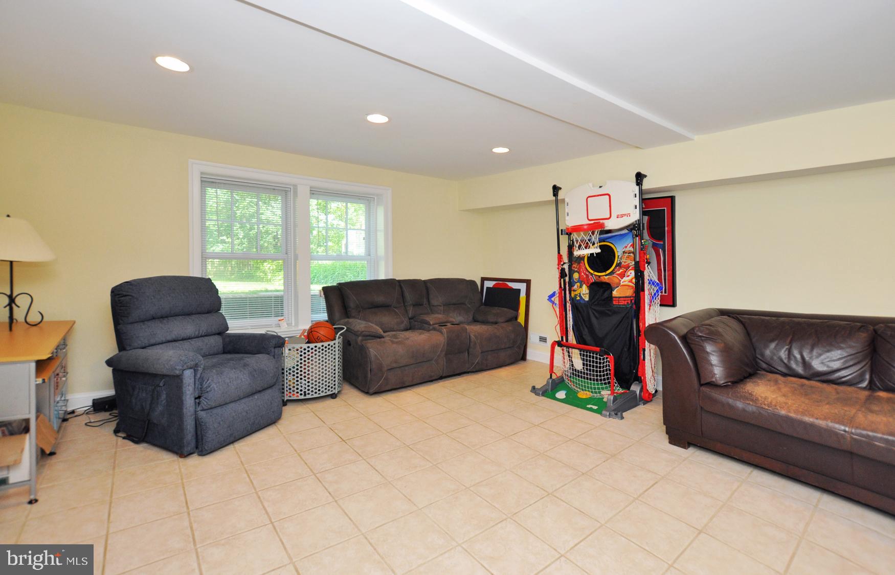 5411 Lambeth Road Bethesda, MD 20814 - Photo 32 of 43 Large Rec Room in lower level w/walk-out to yard