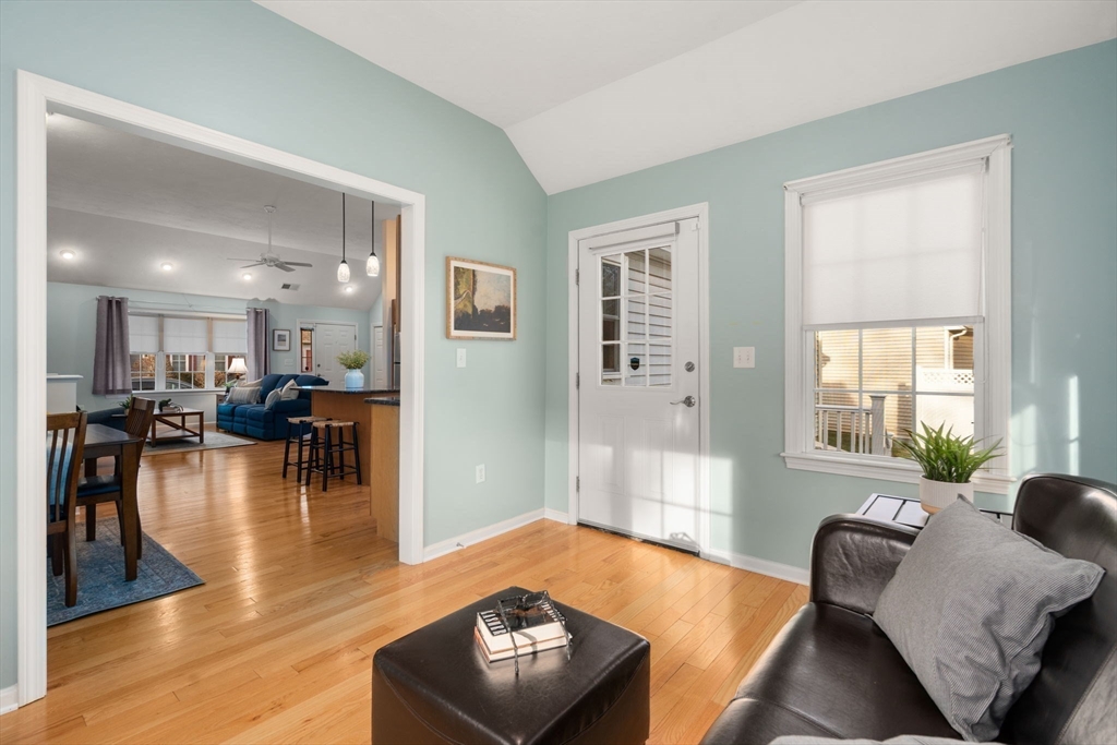 42 Brewster Road, Unit 42 Stoughton, MA 02072 - Photo 12 of 28 a living room with furniture and a wooden floor