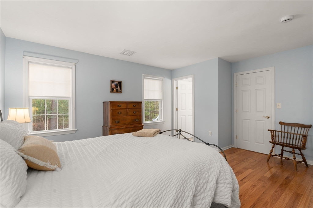 42 Brewster Road, Unit 42 Stoughton, MA 02072 - Photo 13 of 28 a bedroom with a bed and a window