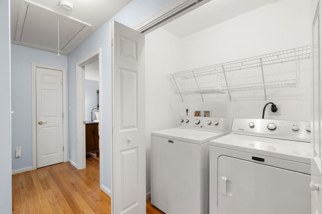 42 Brewster Road, Unit 42 Stoughton, MA 02072 - Photo 16 of 28 a view of a storage & utility room with dryer and washer