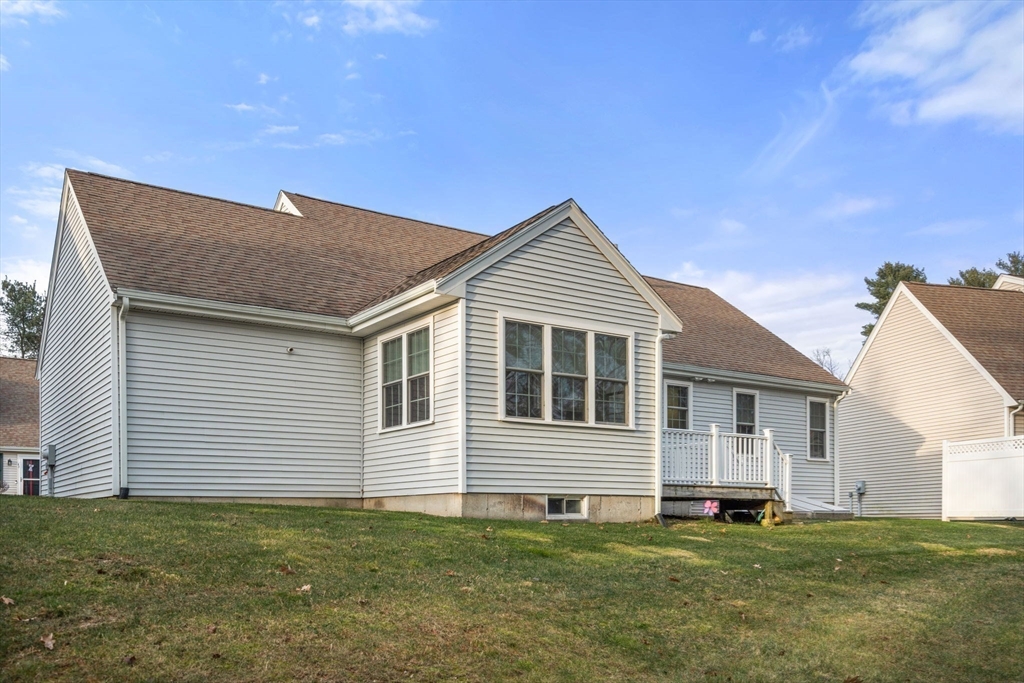 42 Brewster Road, Unit 42 Stoughton, MA 02072 - Photo 18 of 28 a house view with a garden space