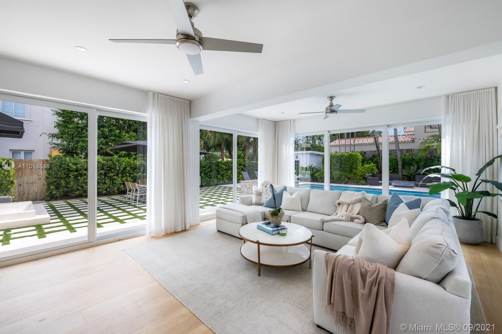 5235 North Bay Road Miami Beach, FL 33140 - Photo 12 of 22 a living room with furniture and a large window