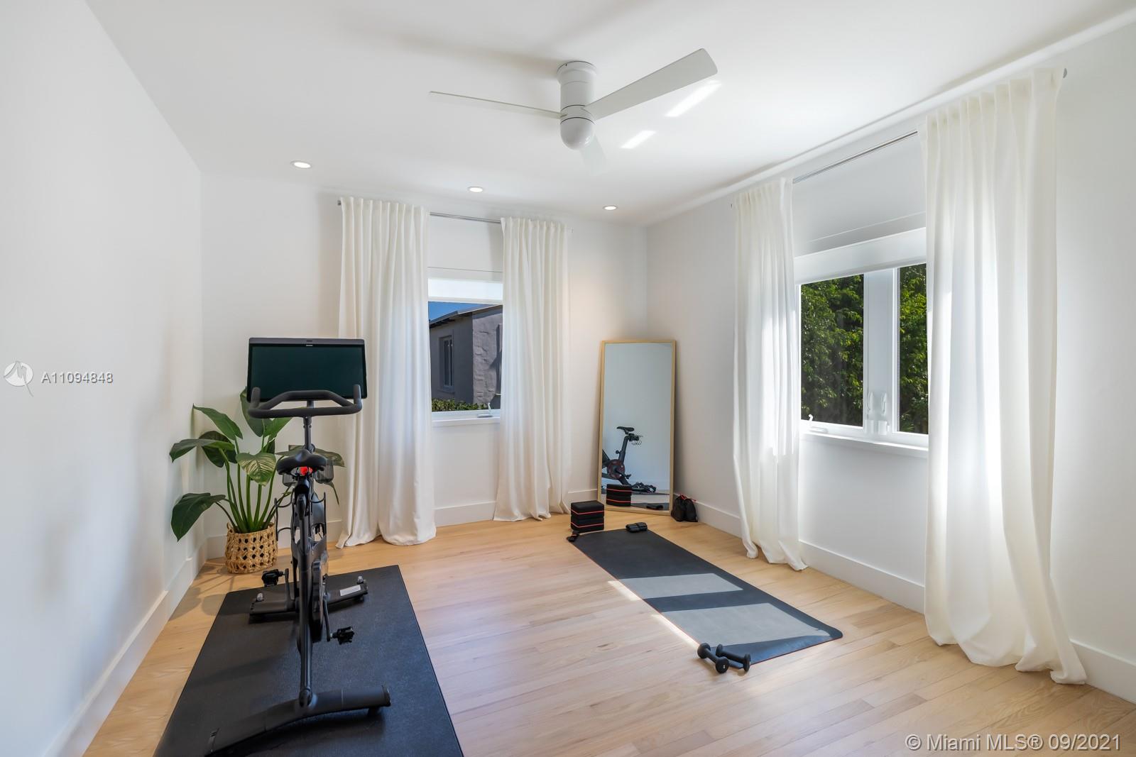 5235 North Bay Road Miami Beach, FL 33140 - Photo 14 of 22 a view of a room with gym equipment