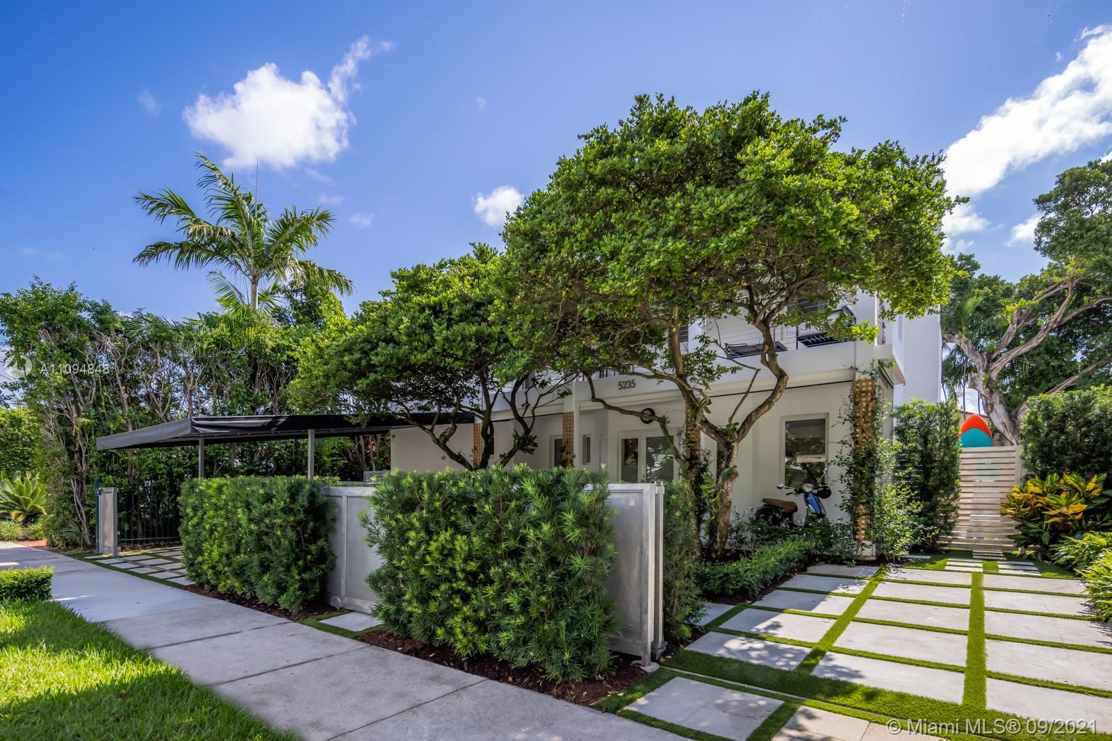 5235 North Bay Road Miami Beach, FL 33140 - Photo 6 of 22 a view of a house with a yard