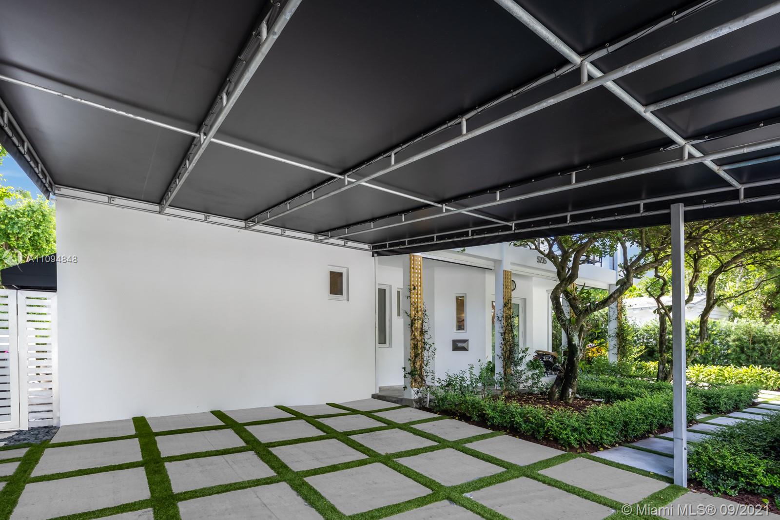 5235 North Bay Road Miami Beach, FL 33140 - Photo 7 of 22 a view of backyard with porch
