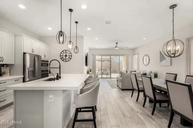 a very nice looking dining room with furniture