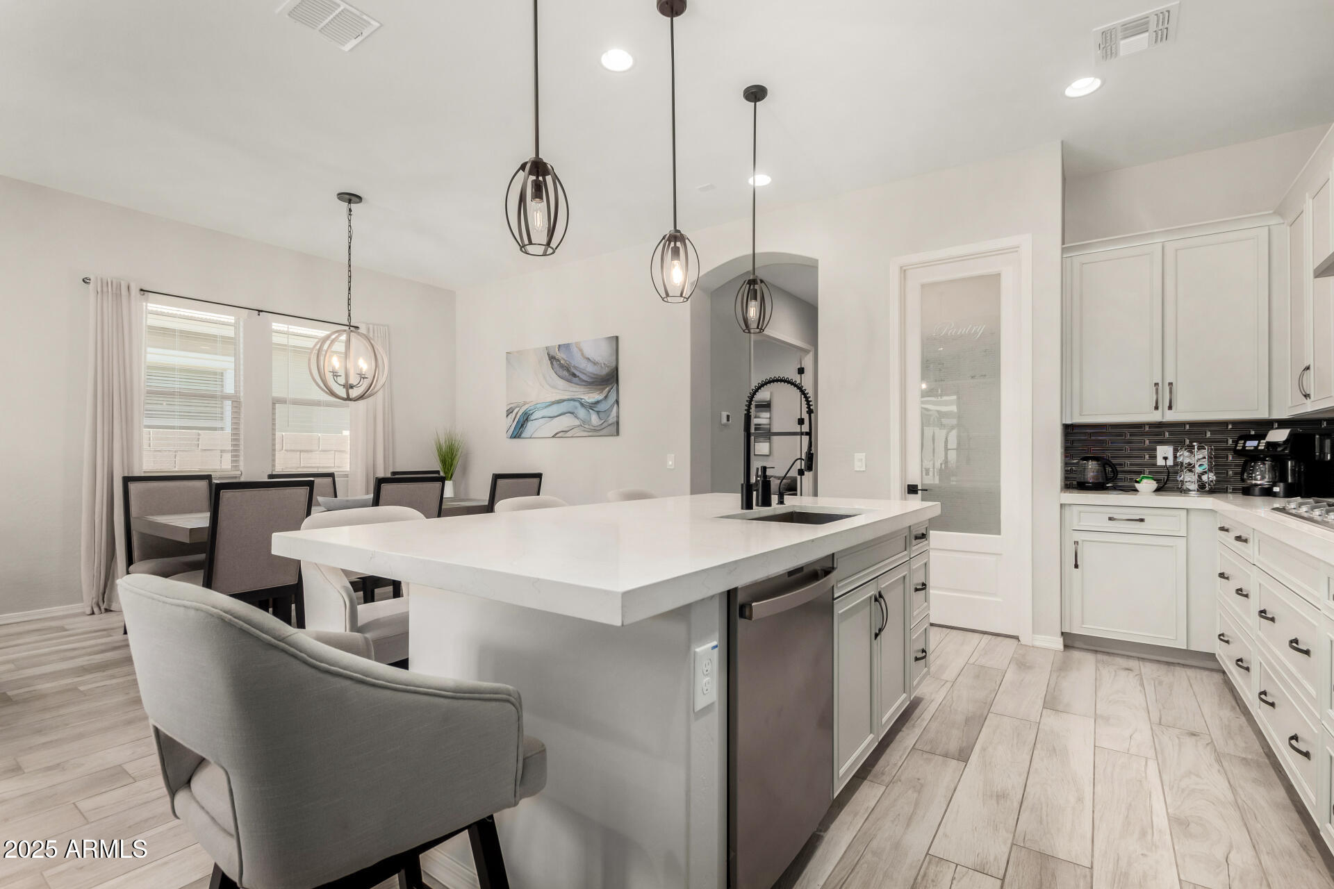 23129 East Carriage Way Queen Creek, AZ 85142 - Photo 17 of 50 a kitchen with white cabinets appliances and cabinets