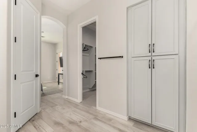 wooden floor with white cabinet