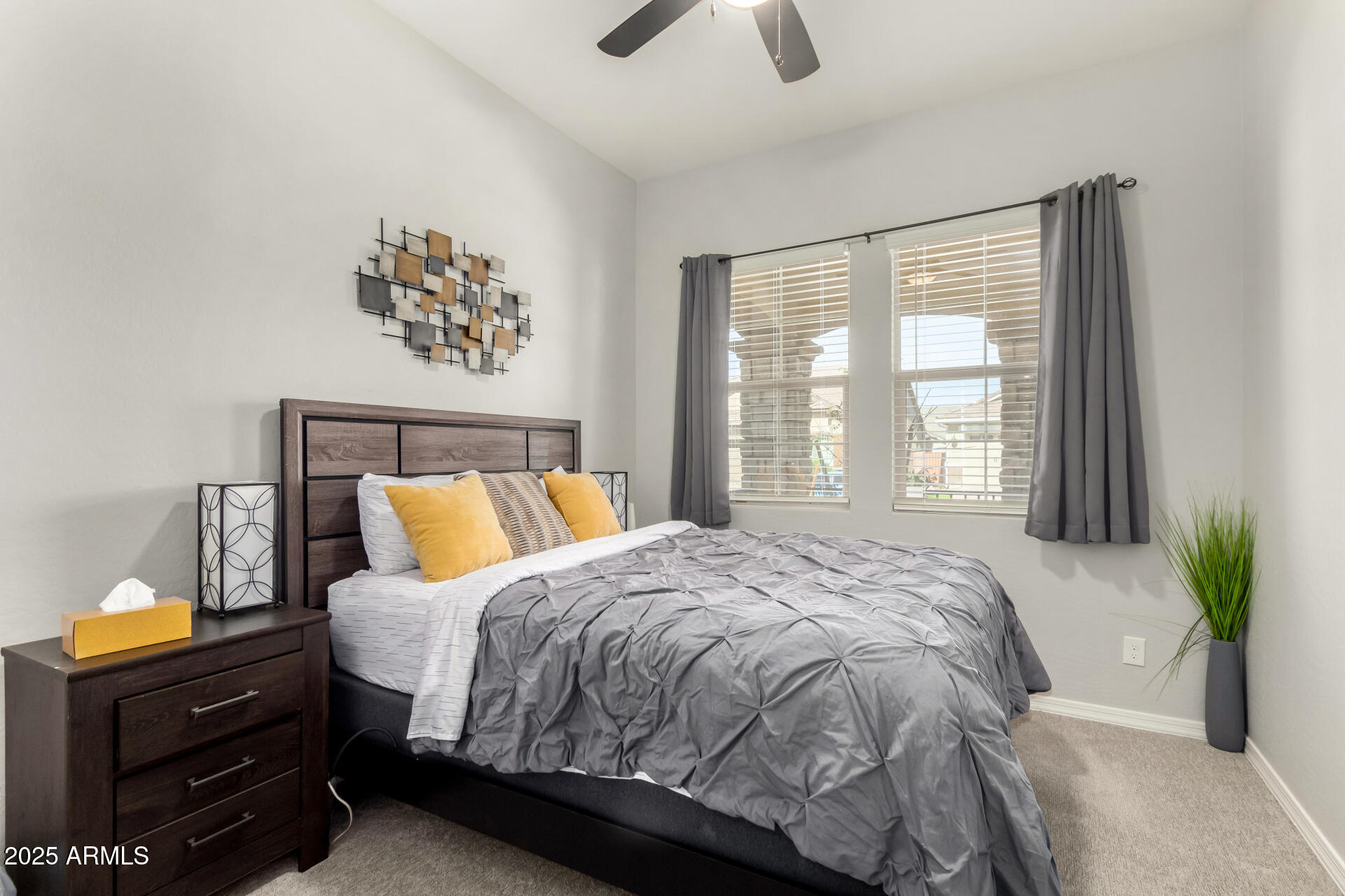 23129 East Carriage Way Queen Creek, AZ 85142 - Photo 26 of 50 a bed sitting in a bedroom next to a window