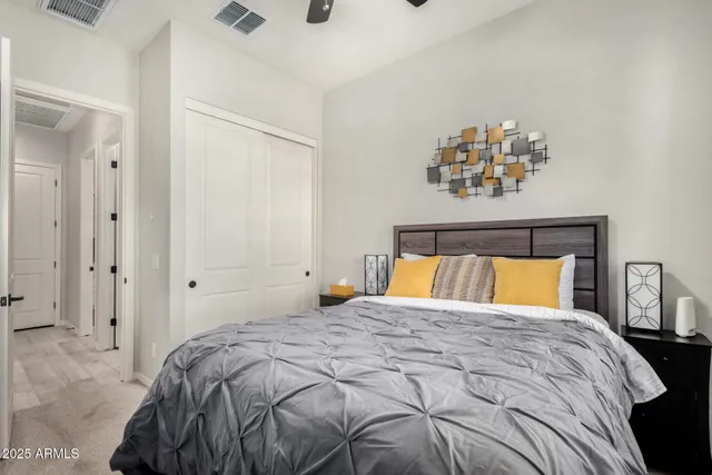 a bathroom with a sink a toilet and shower curtain
