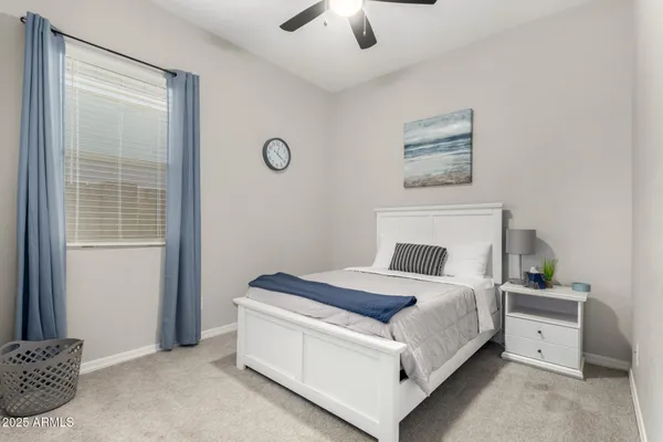 a bedroom with a bed and a closet
