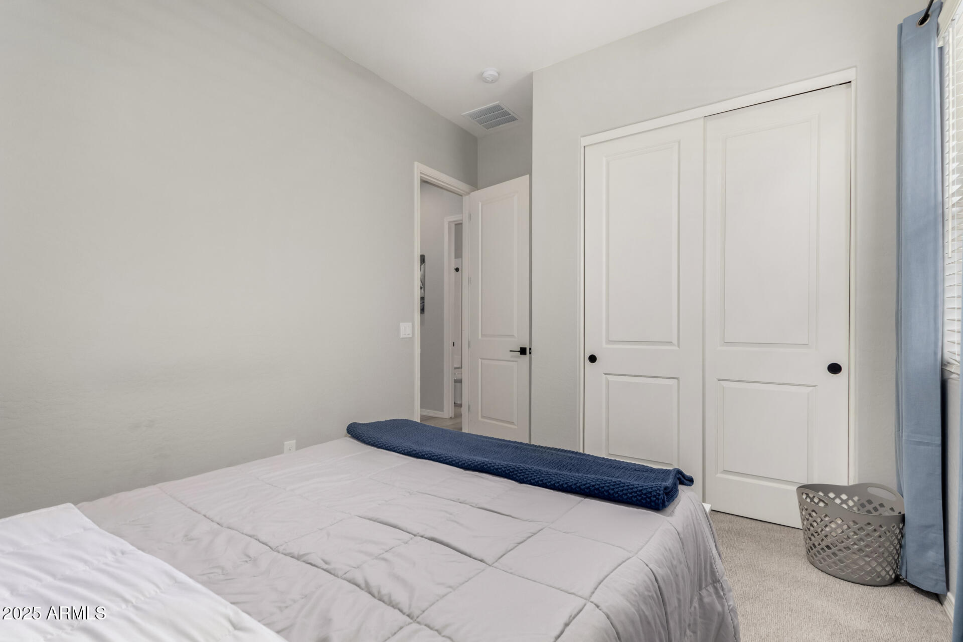 23129 East Carriage Way Queen Creek, AZ 85142 - Photo 30 of 50 a bedroom with a bed and a closet