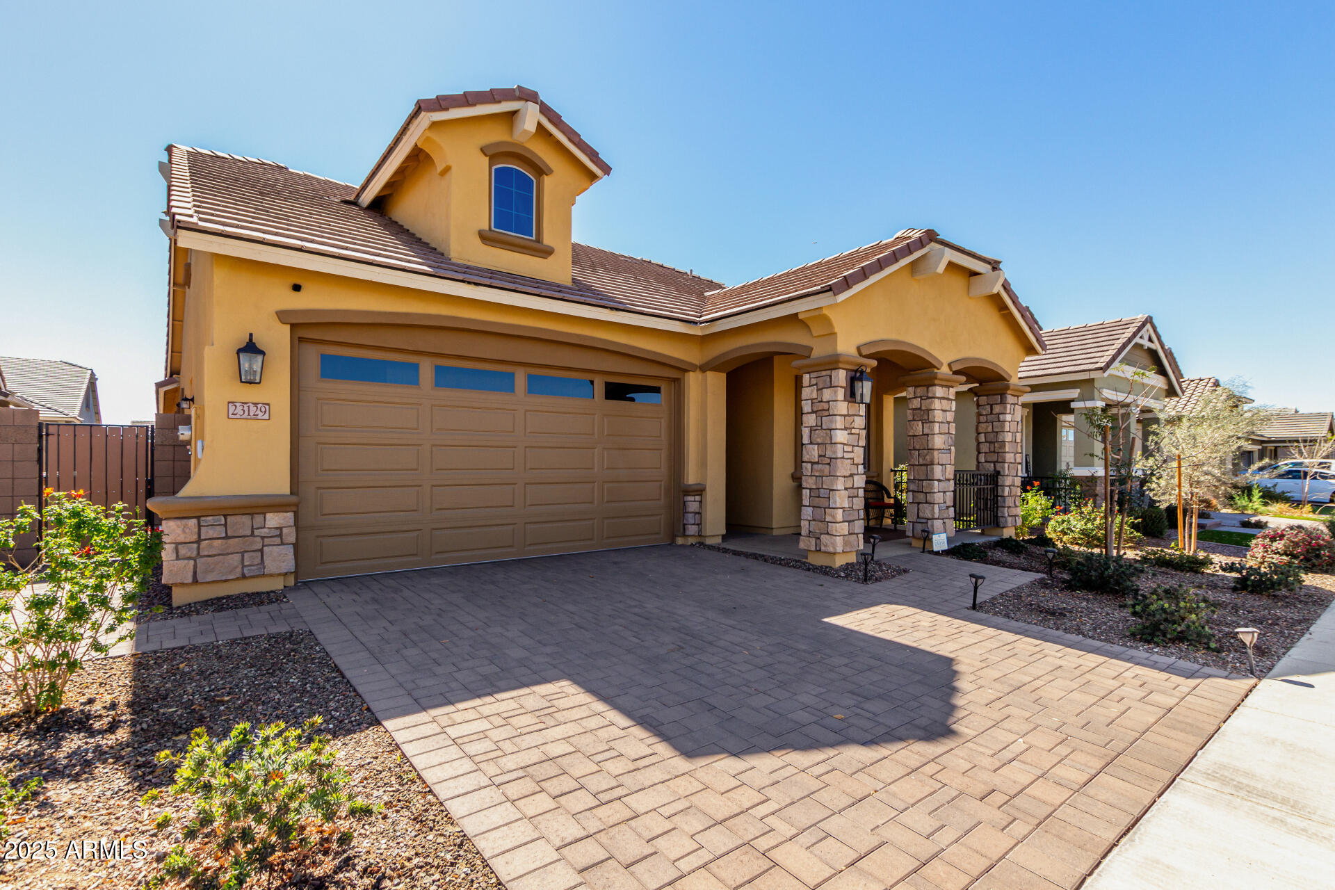 23129 East Carriage Way Queen Creek, AZ 85142 - Photo 3 of 50 a front view of a house with a yard