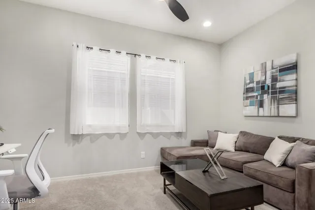 a living room with furniture and a window