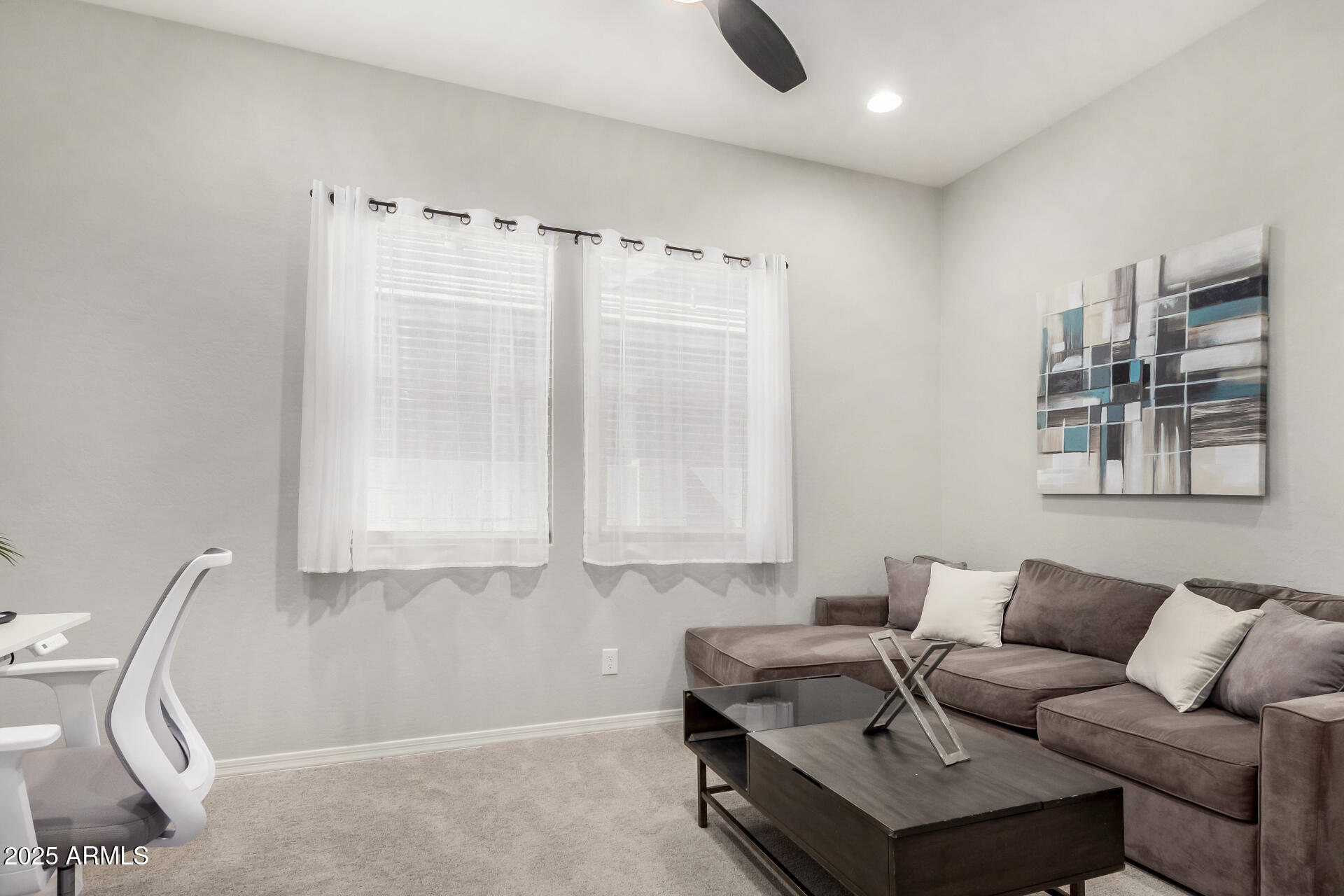 23129 East Carriage Way Queen Creek, AZ 85142 - Photo 34 of 50 a living room with furniture a rug and a window