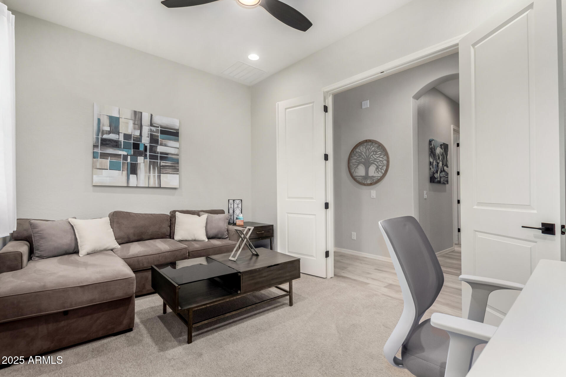 23129 East Carriage Way Queen Creek, AZ 85142 - Photo 36 of 50 a living room with furniture and a clock