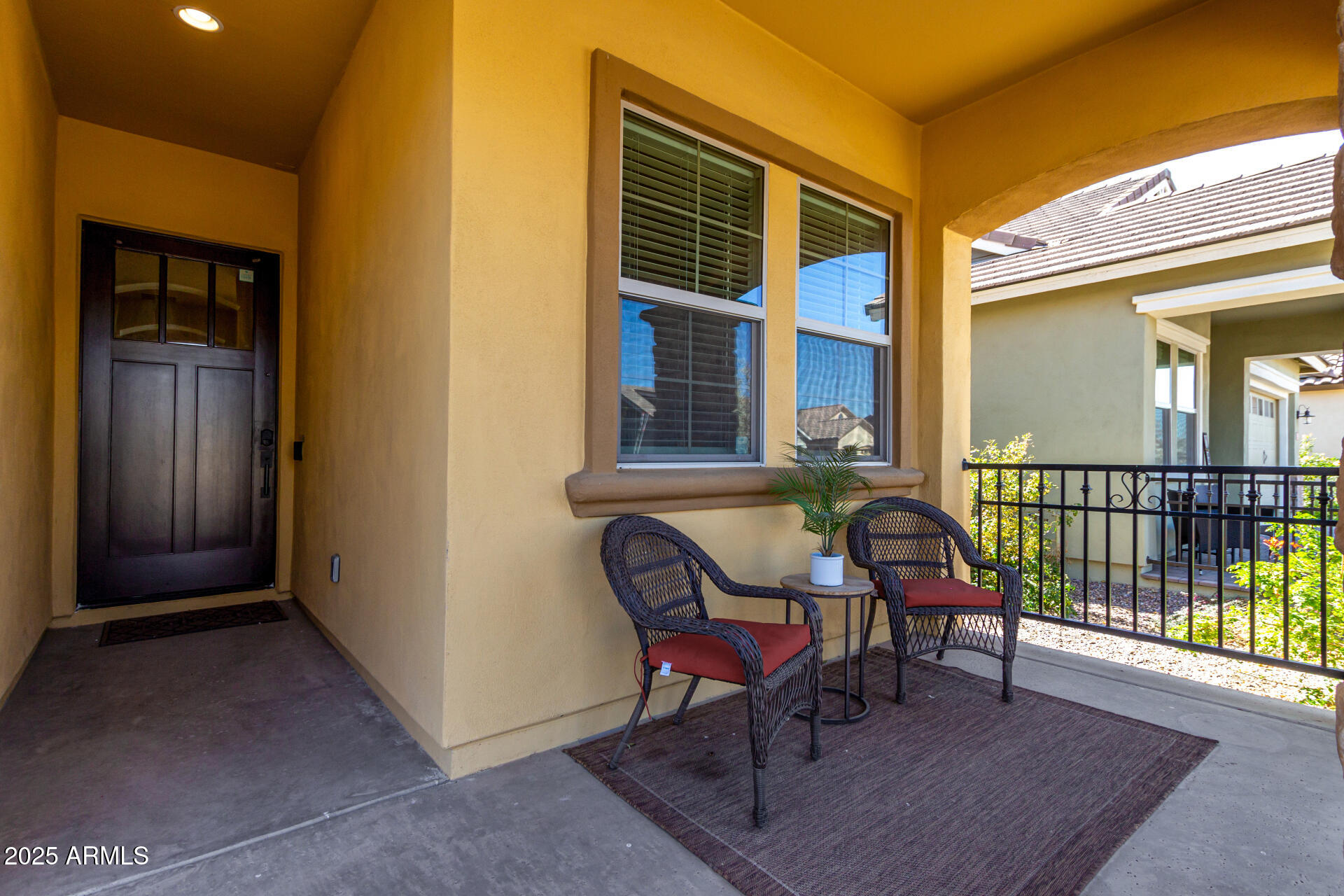 23129 East Carriage Way Queen Creek, AZ 85142 - Photo 4 of 50 a balcony with table and chairs