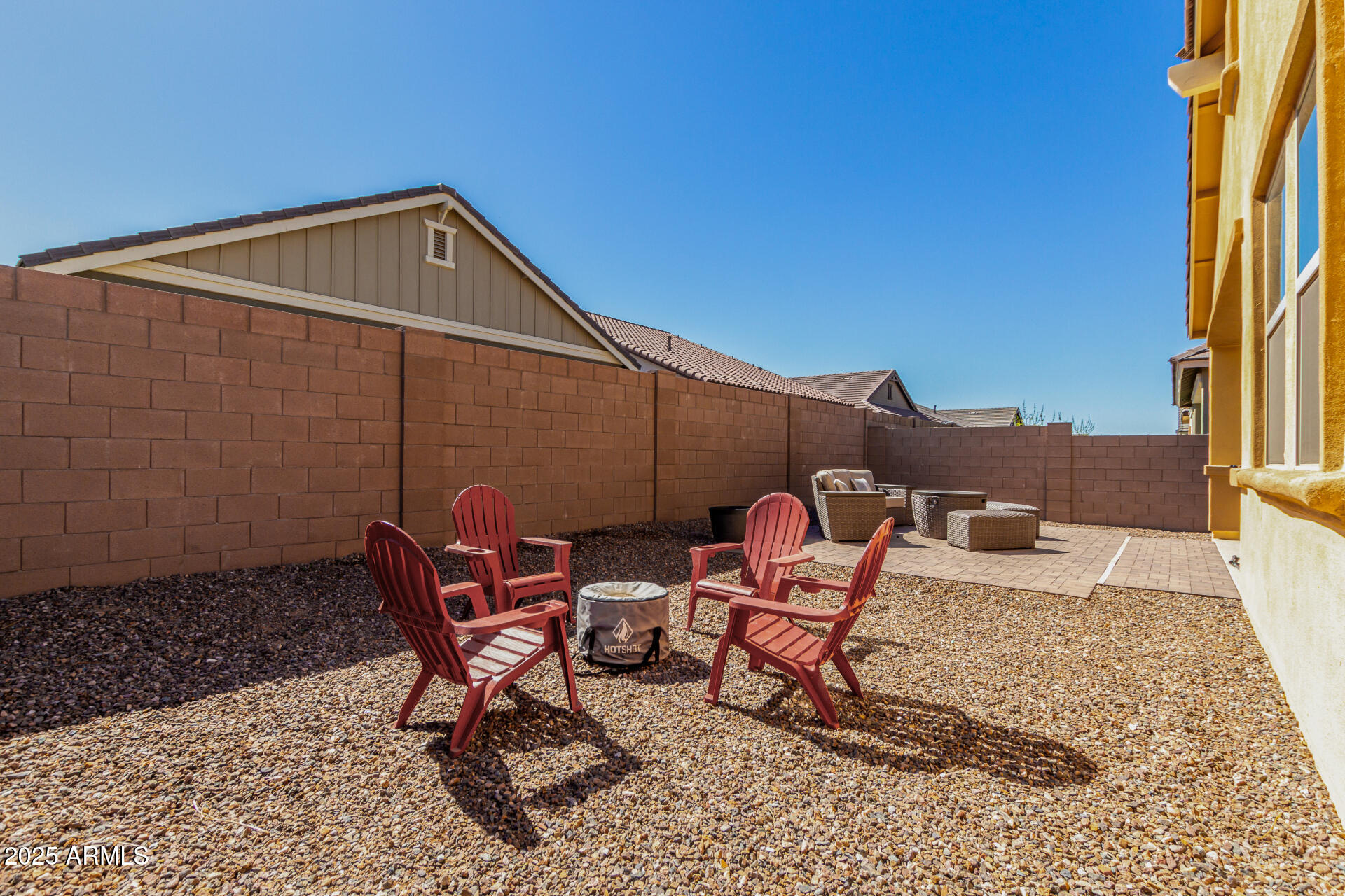 23129 East Carriage Way Queen Creek, AZ 85142 - Photo 45 of 50 a backyard of a house with table and chairs
