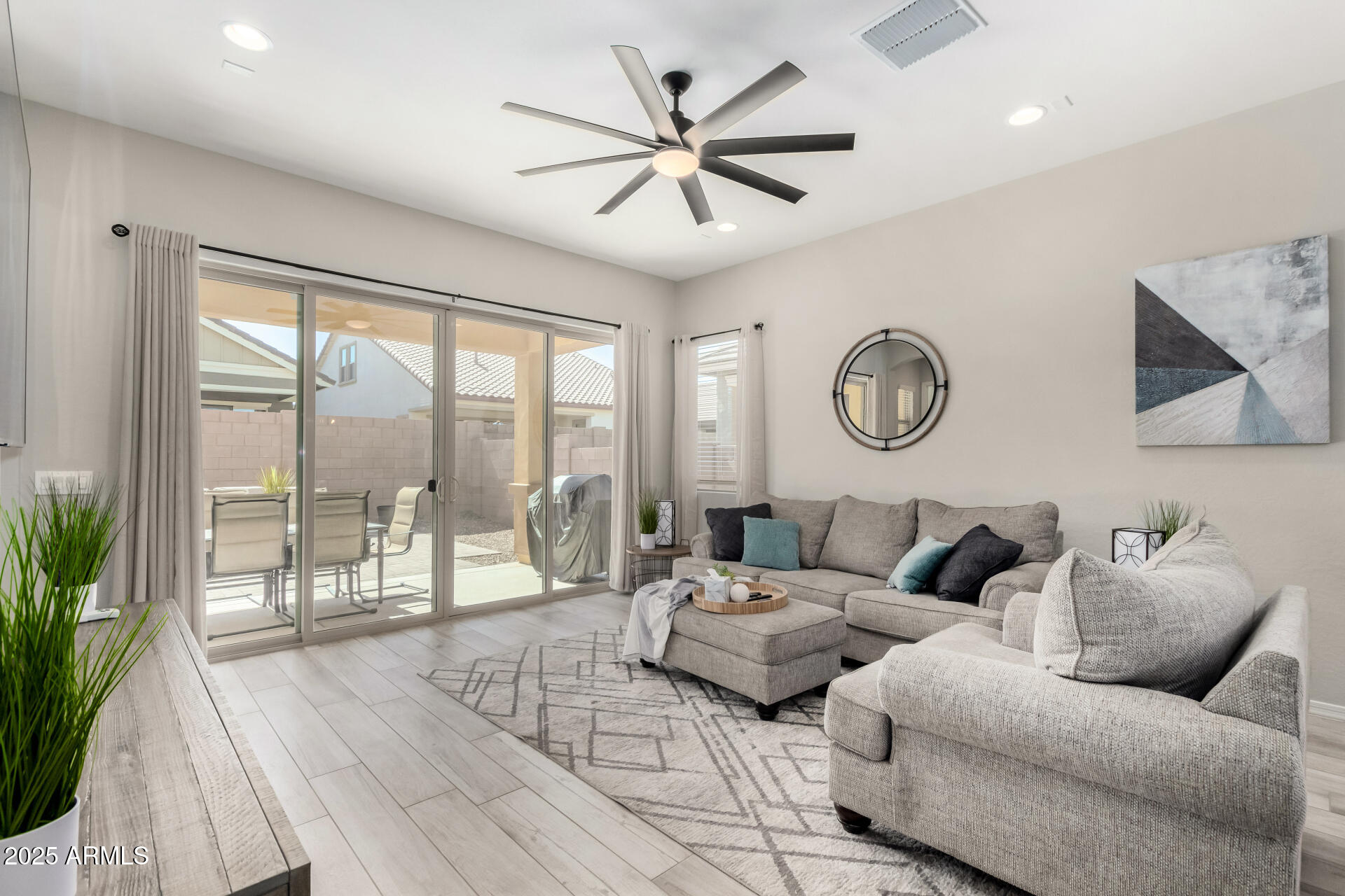 23129 East Carriage Way Queen Creek, AZ 85142 - Photo 7 of 50 a living room with furniture and a large window with garden view