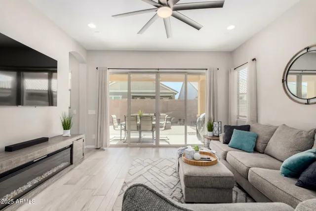 a living room with furniture and a large window