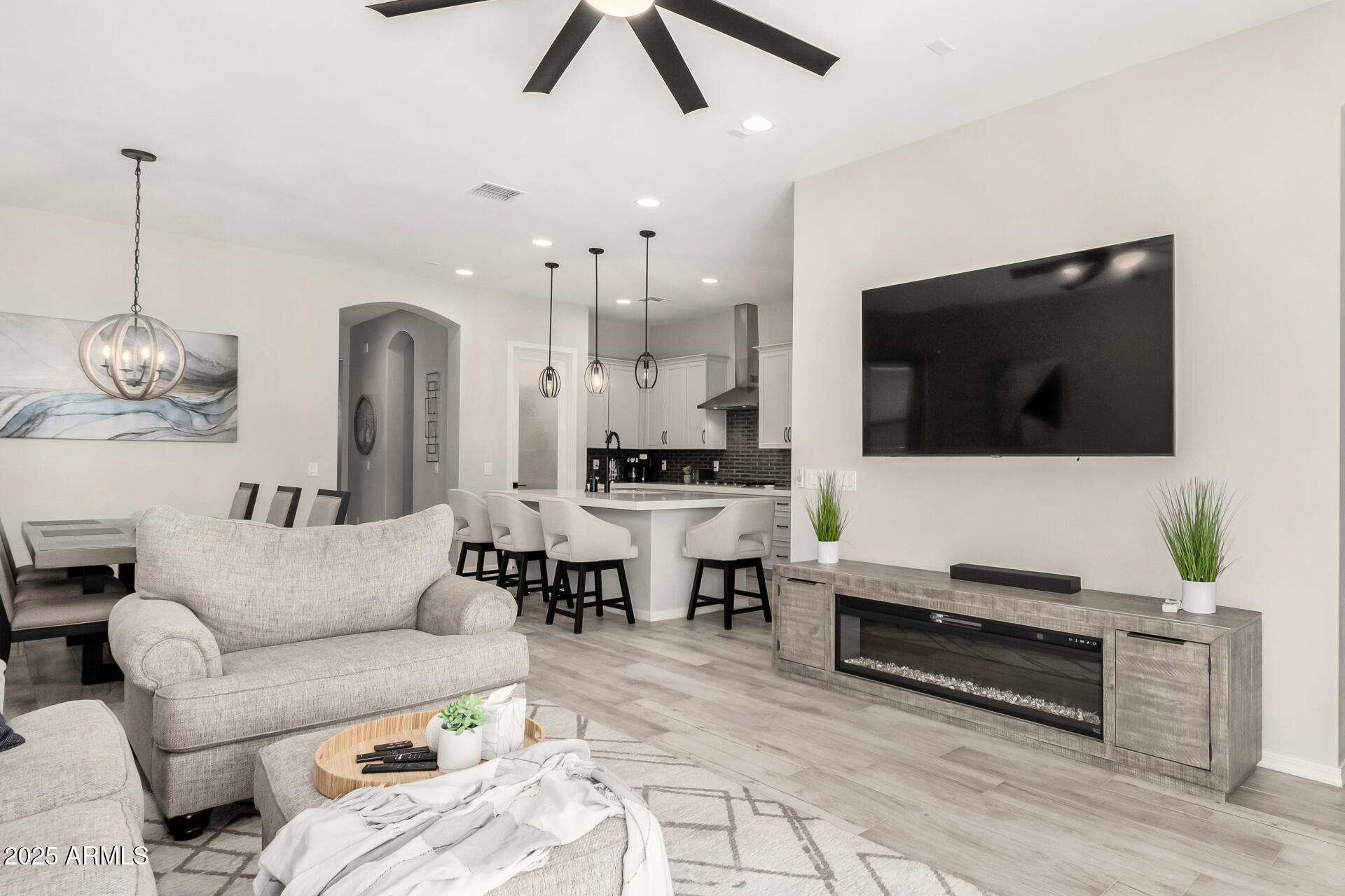 23129 East Carriage Way Queen Creek, AZ 85142 - Photo 10 of 50 a living room with furniture and a flat screen tv