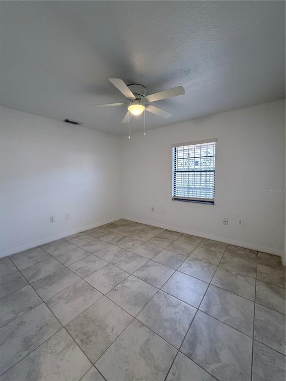 2924 West Kathleen Street Tampa, FL 33607 - Photo 14 of 20 a view of an empty room with a window