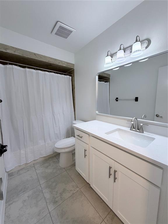2924 West Kathleen Street Tampa, FL 33607 - Photo 15 of 20 a bathroom with a double vanity sink and a mirror