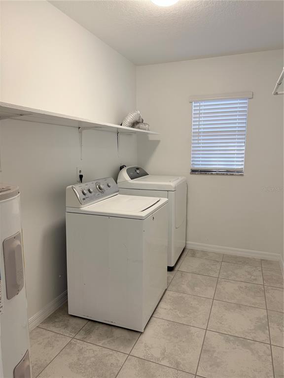 2924 West Kathleen Street Tampa, FL 33607 - Photo 10 of 20 a utility room with a sink a washer and dryer
