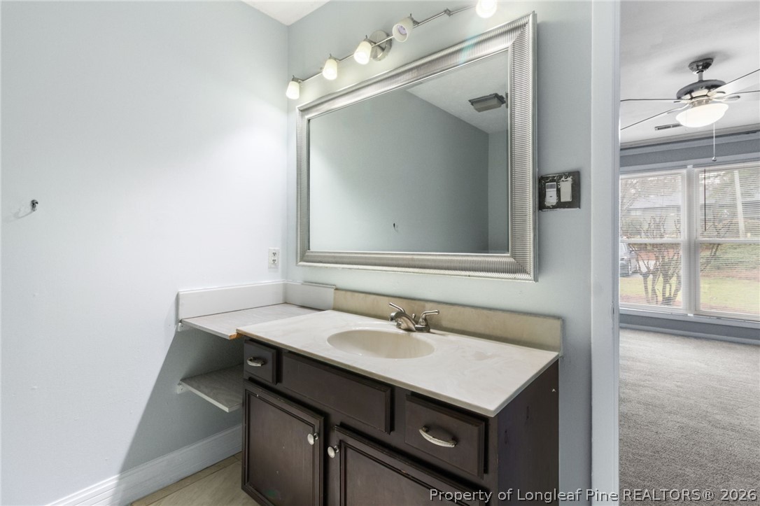 1908 Tryon Drive, Unit 1 Fayetteville, NC 28303 - Photo 19 of 29 a bathroom with a sink vanity and a mirror