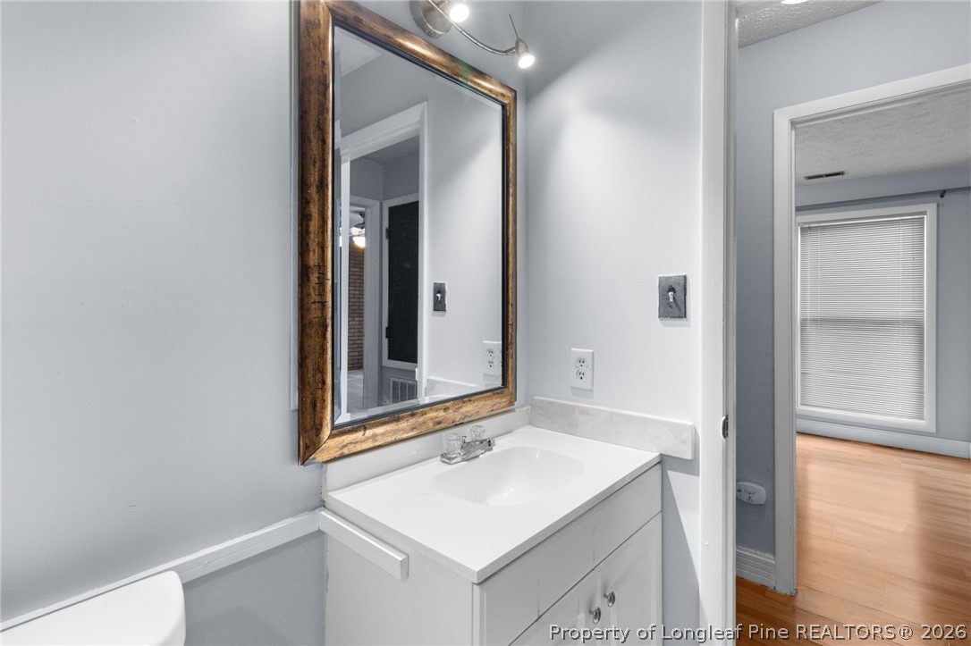 1908 Tryon Drive, Unit 1 Fayetteville, NC 28303 - Photo 25 of 29 a bathroom with a sink and a mirror