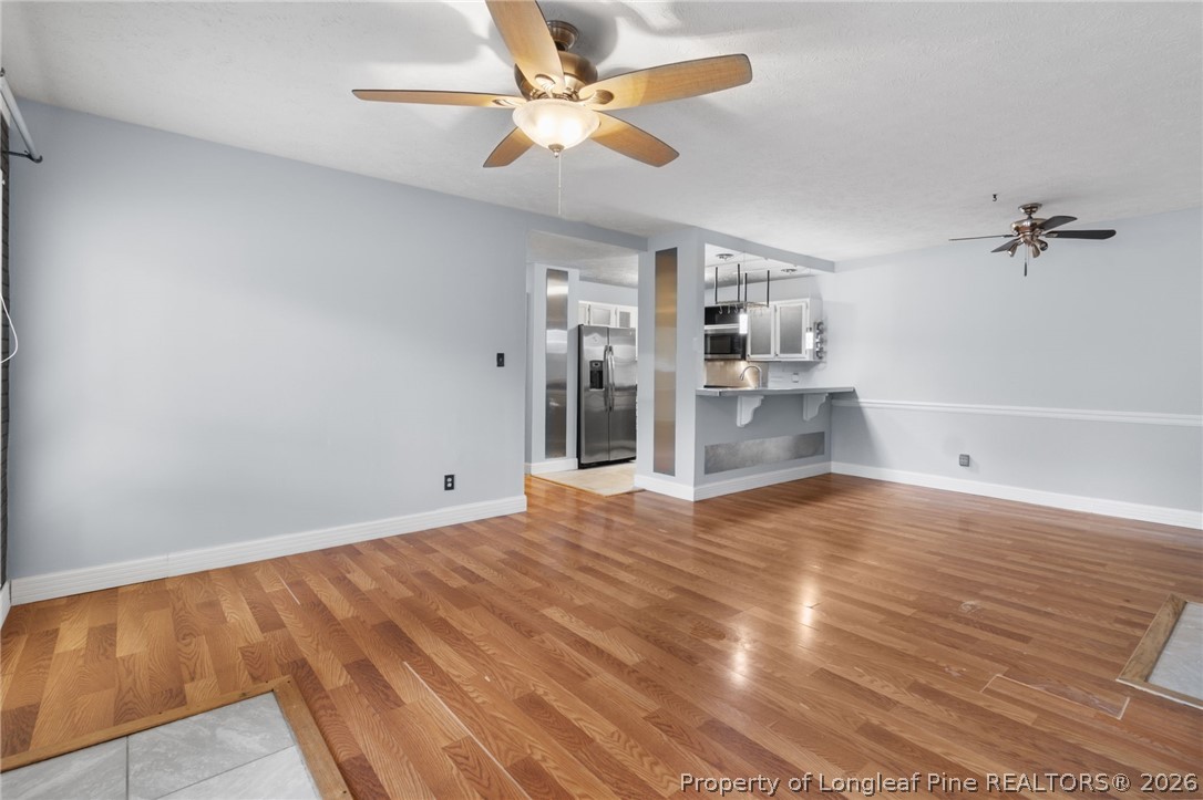 1908 Tryon Drive, Unit 1 Fayetteville, NC 28303 - Photo 8 of 29 wooden floor in an empty room with a window