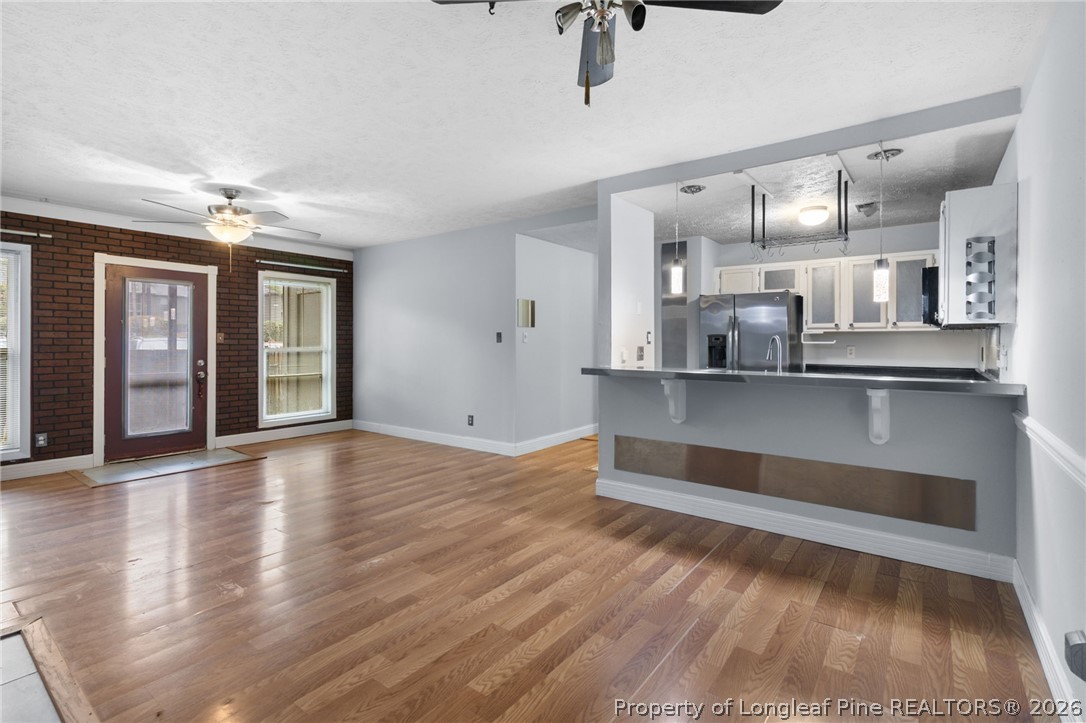 1908 Tryon Drive, Unit 1 Fayetteville, NC 28303 - Photo 10 of 29 a living room with stainless steel appliances kitchen island granite countertop furniture and a kitchen view