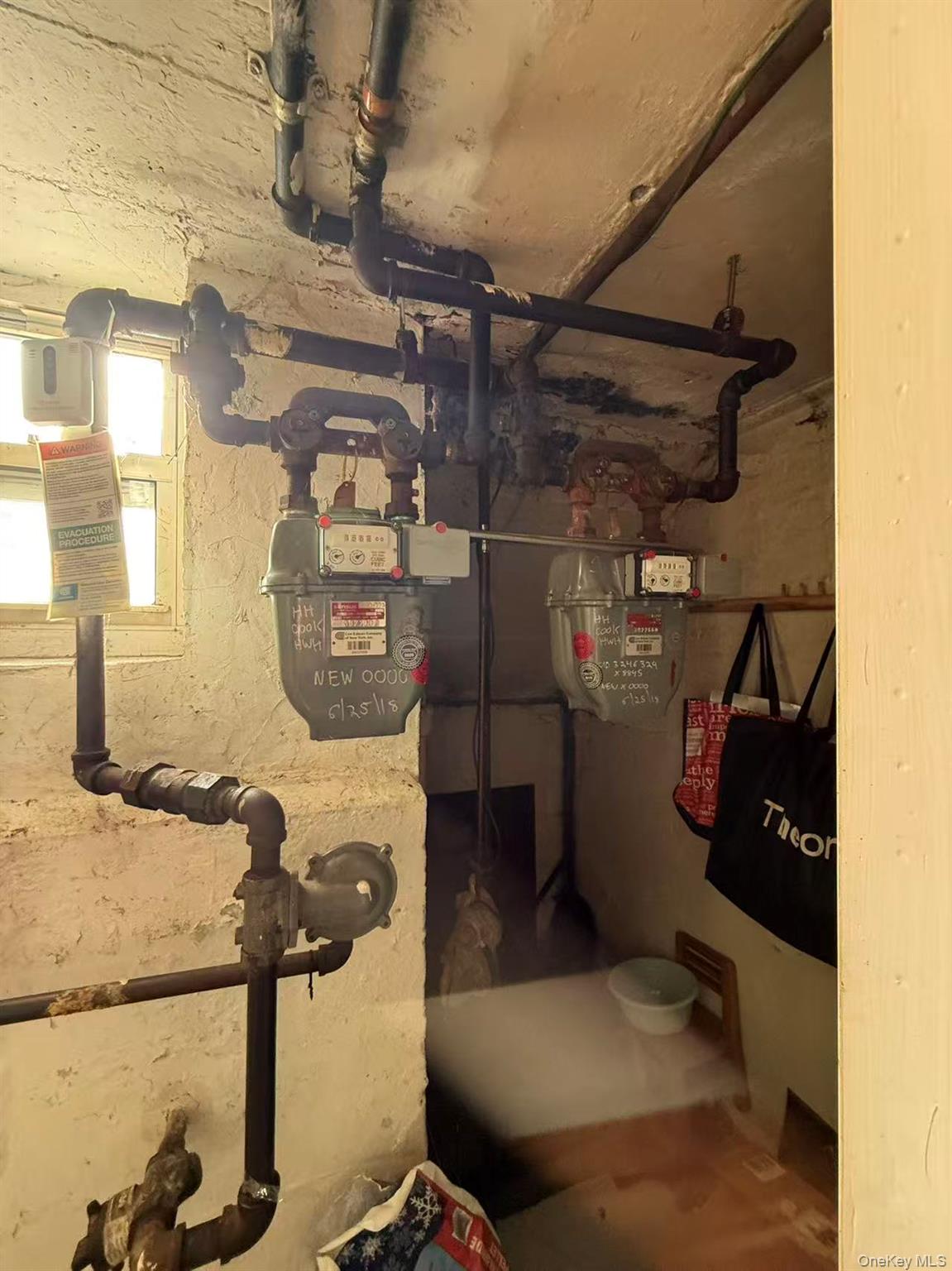 146-27 61st Road Queens, NY 11367 - Photo 14 of 17 Utility room with gas meter