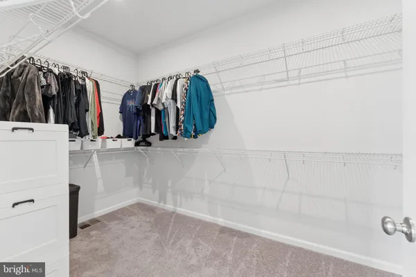 a view of a room with racks on the wall