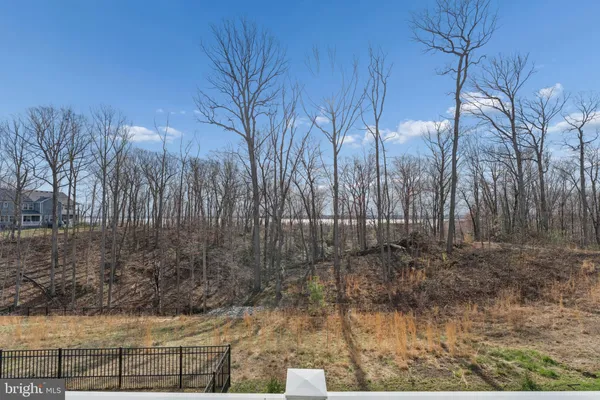 an aerial view of a house with outdoor space