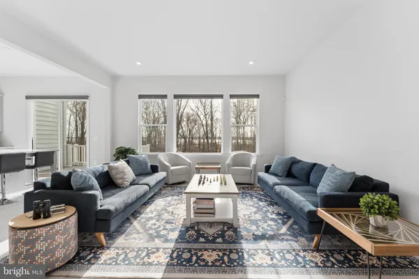 a living room with furniture and a table