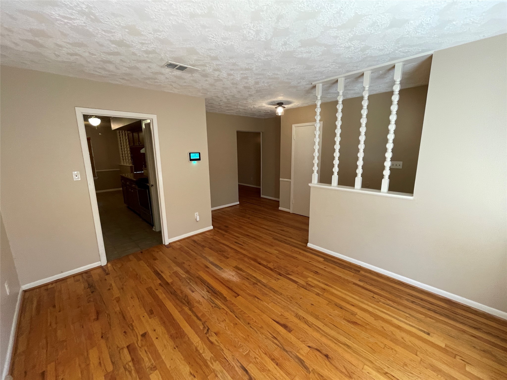 181 Greenleaf Lane Conroe, TX 77304 - Photo 3 of 15 wooden floor in an empty room
