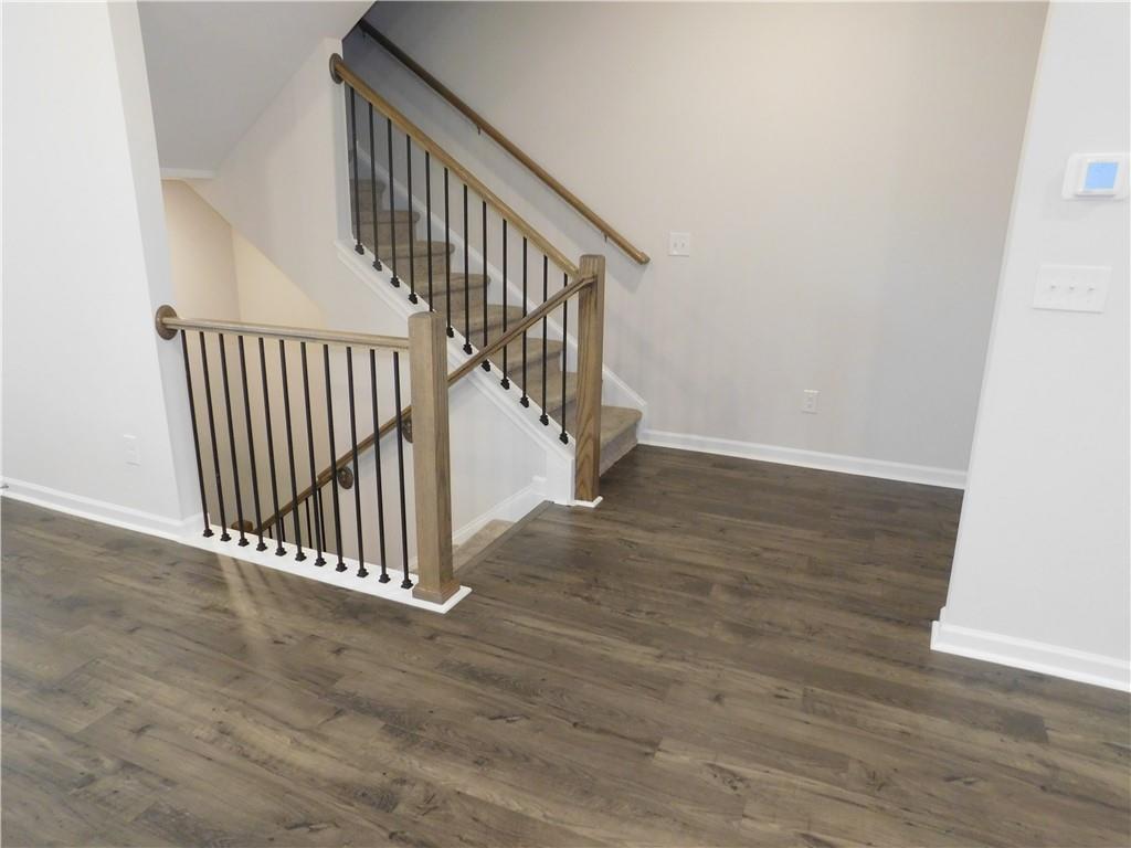 1626 Halbrook Place Southwest Marietta, GA 30008 - Photo 11 of 43 a view of a hallway with wooden floor and entryway