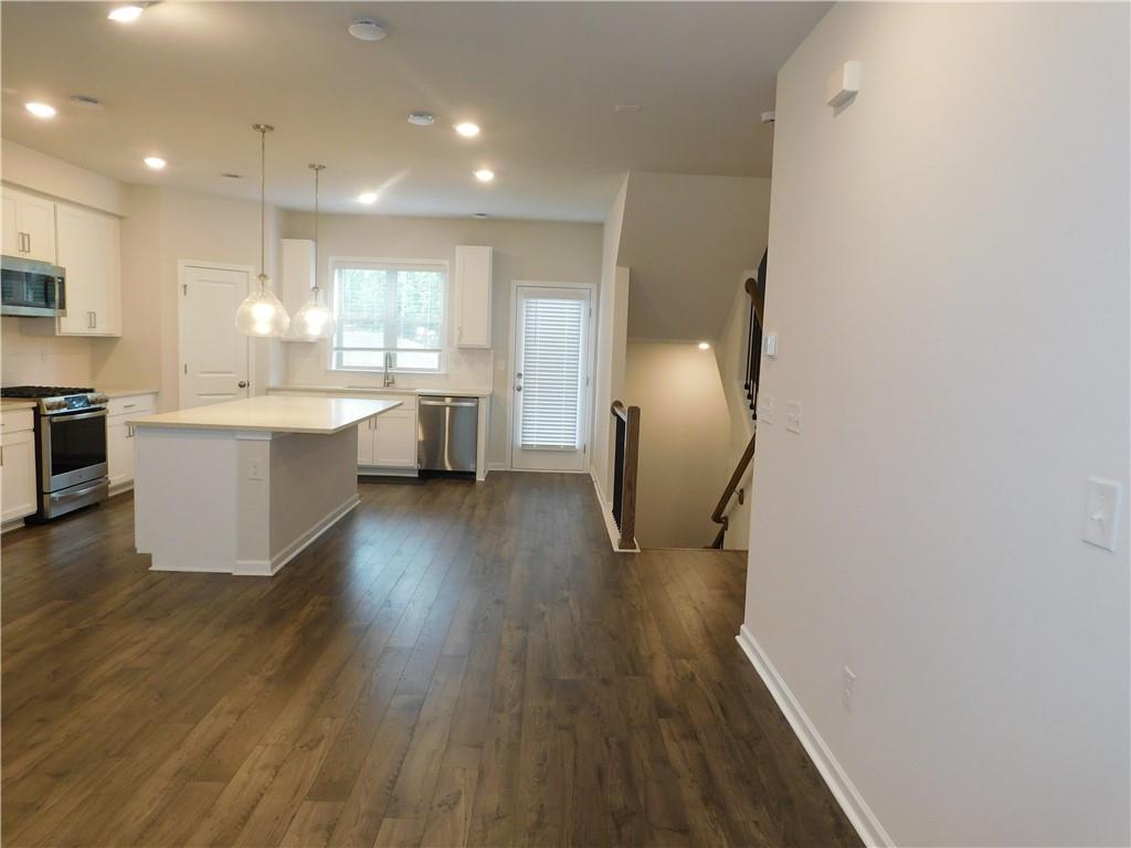 1626 Halbrook Place Southwest Marietta, GA 30008 - Photo 13 of 43 a view of a kitchen with cabinets and wooden floor